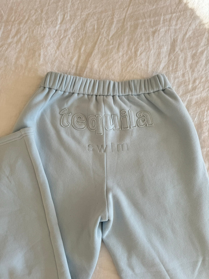 Light blue Bunny Sweatpants with elastic waistband and embroidered "tequila swim" logo on the back waistband
