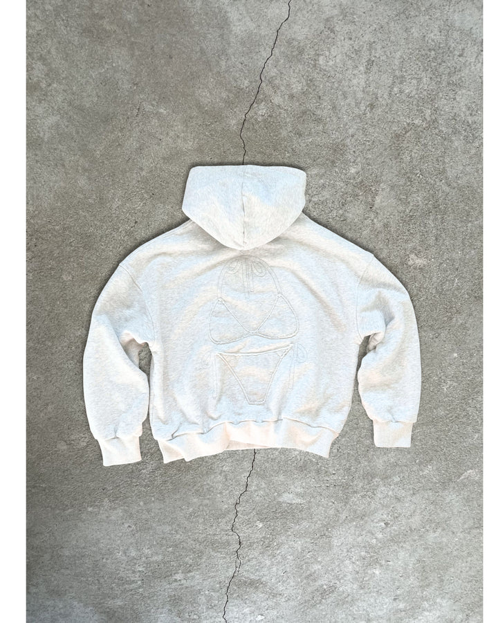 Light gray Bunny Hug Hoodie with subtle embroidered design, laid flat on concrete background showing back view.